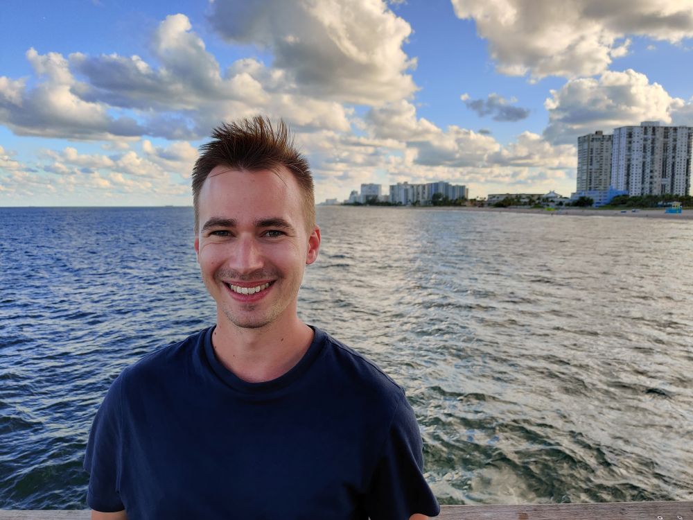 Zsolt Boros posing and smiling out on a pier in West Palm Beach